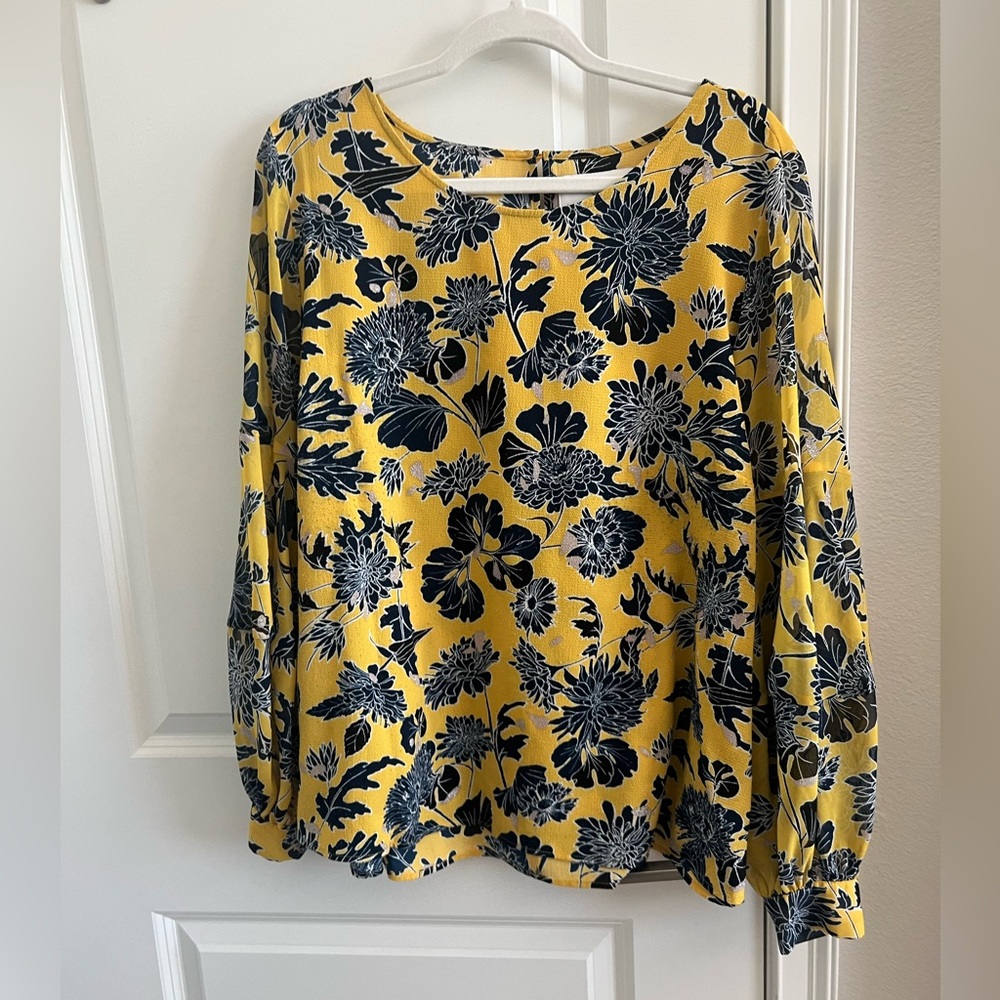 Yellow long sleeve blouse with dark blue flowers.